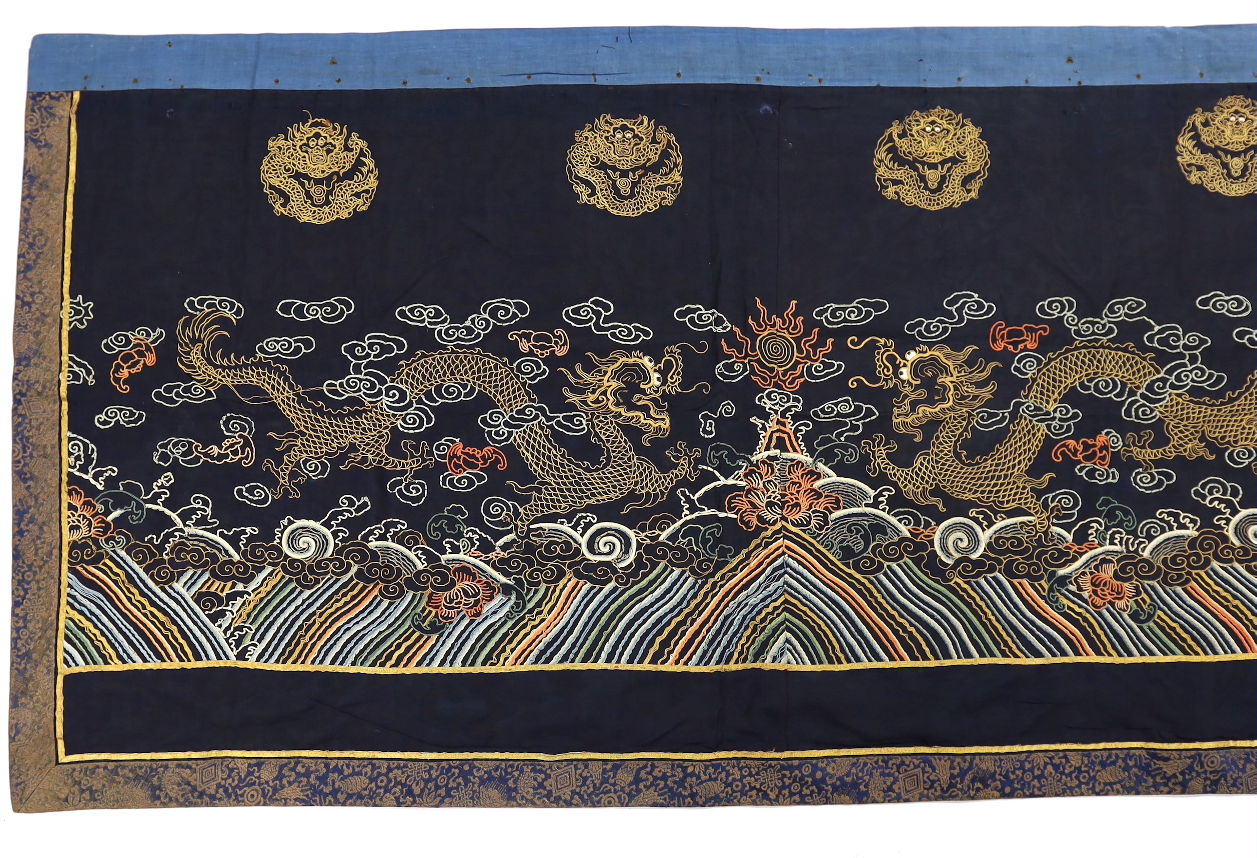 A Chinese long gauze gold dragon and multi-coloured embroidered altar cloth, with brocade borders, 290cm long x 78cm high